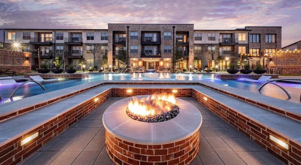 a view of a swimming pool and a patio