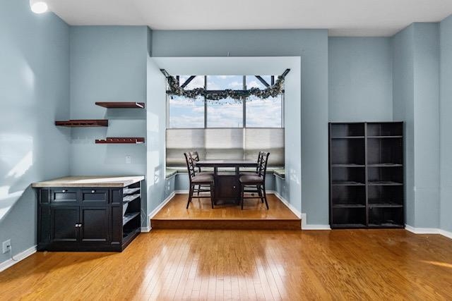 a living room with a flat screen tv and window