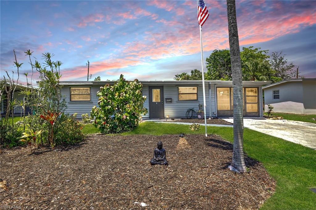 Ranch-style house with a yard