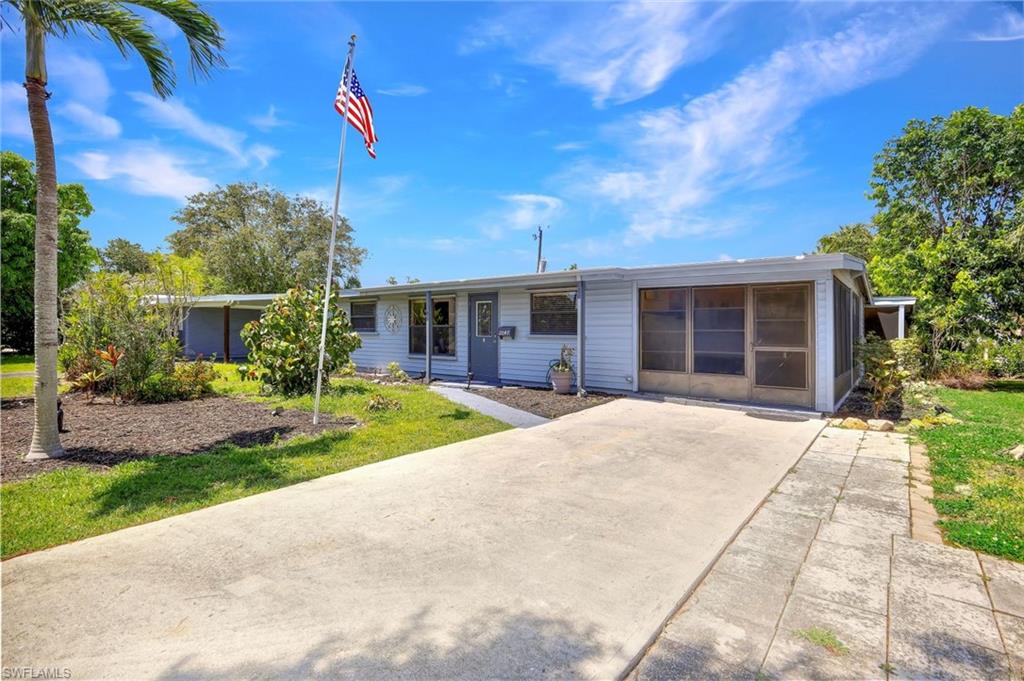 a house with yard in front of it