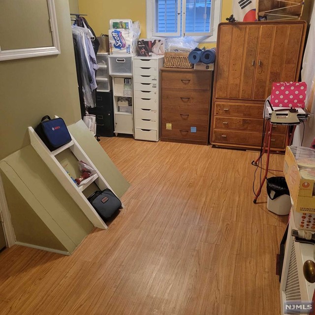 a bed room with a bed and a desk