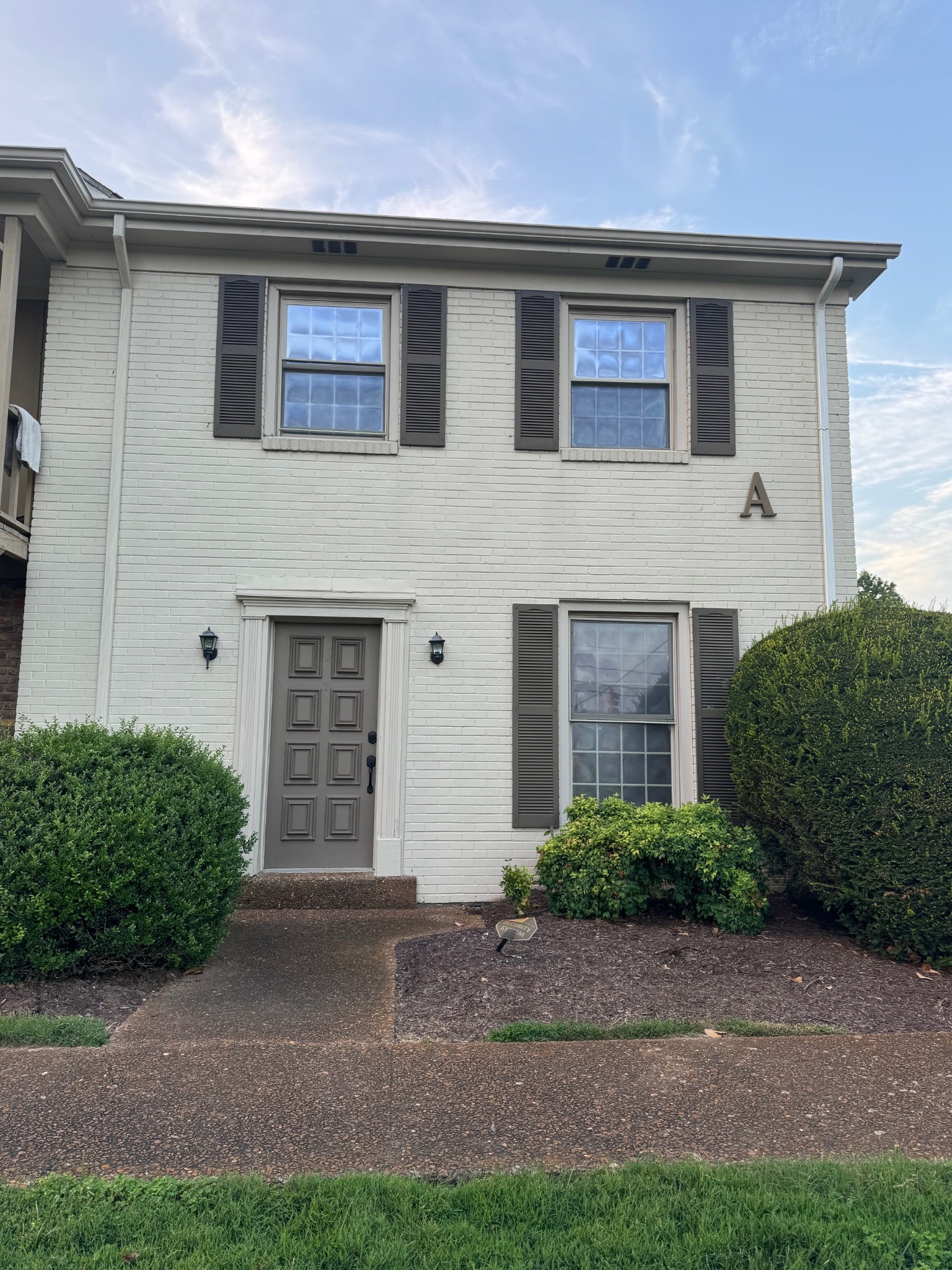 a front view of a house with garage