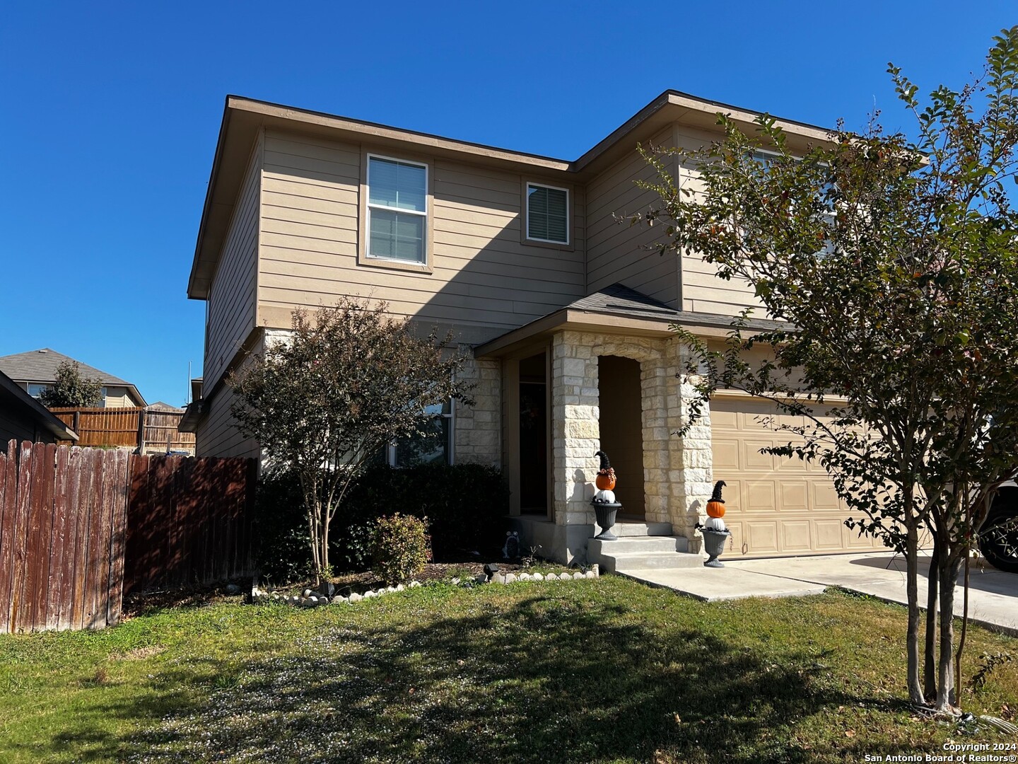 a front view of a house with a yard