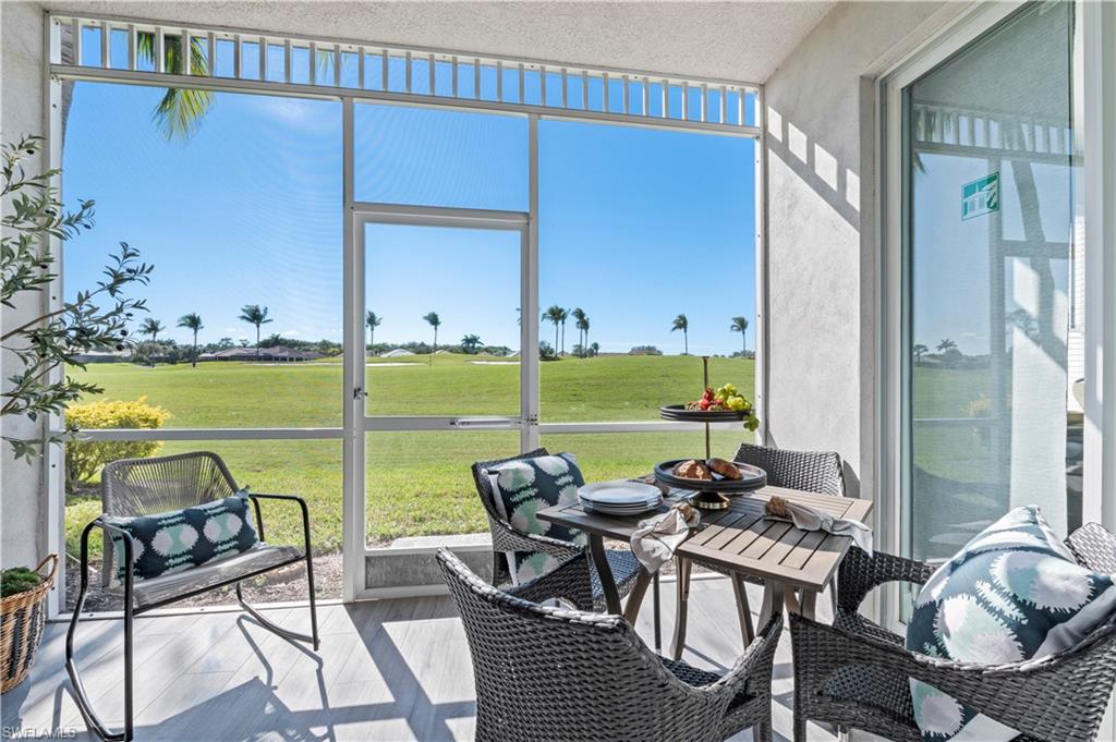 a view of a chairs and table in patio