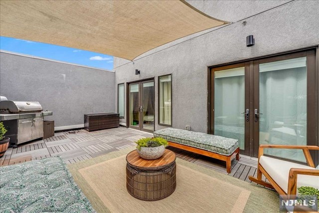 a living room with furniture and a outdoor space