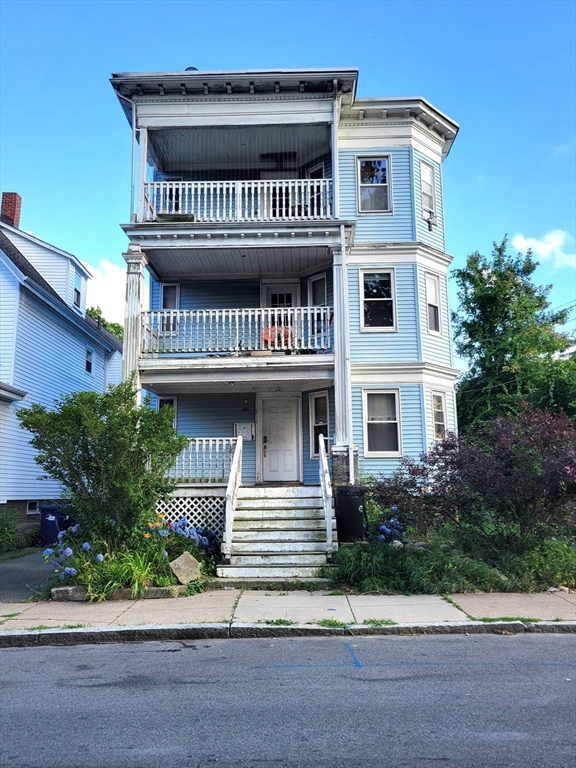 a view of a house with a street