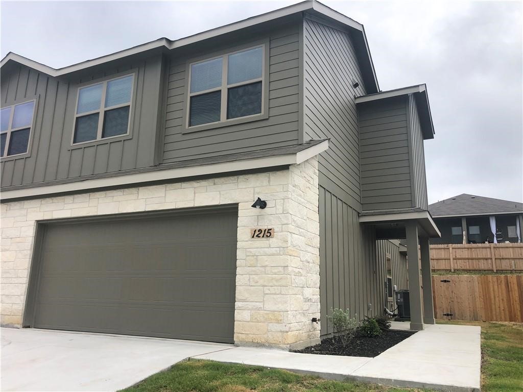 a front view of a house with garage