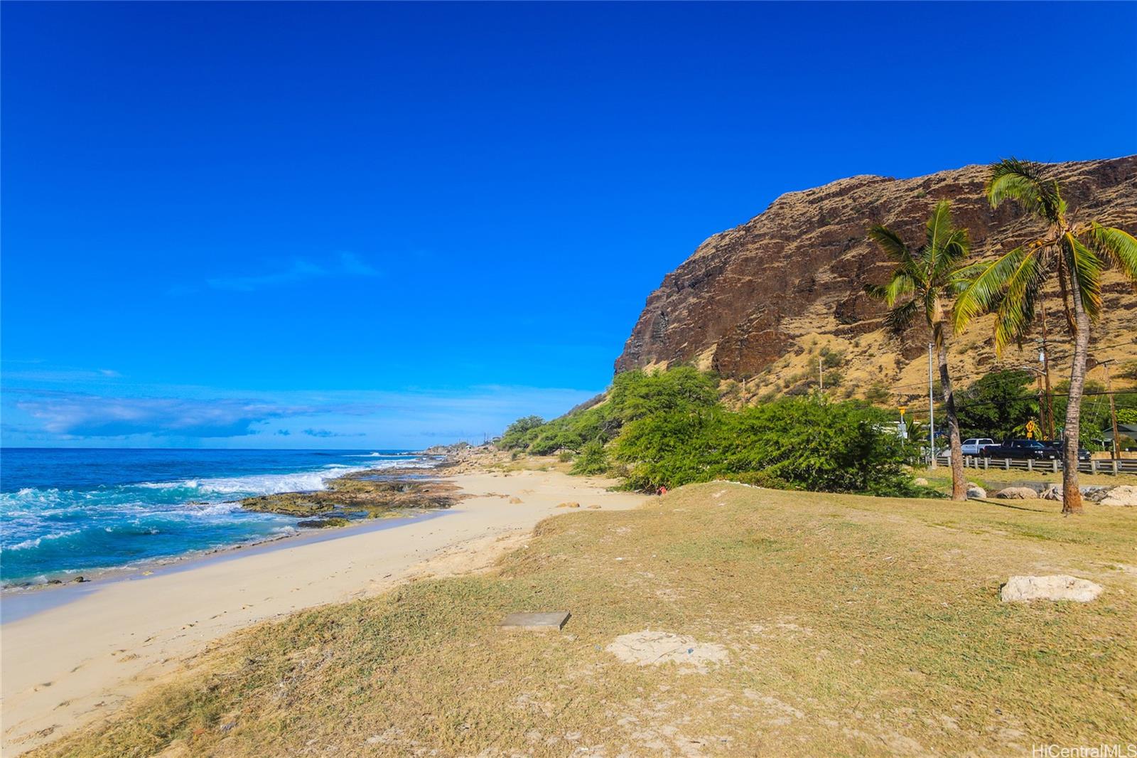 a view of an ocean with a building in the background