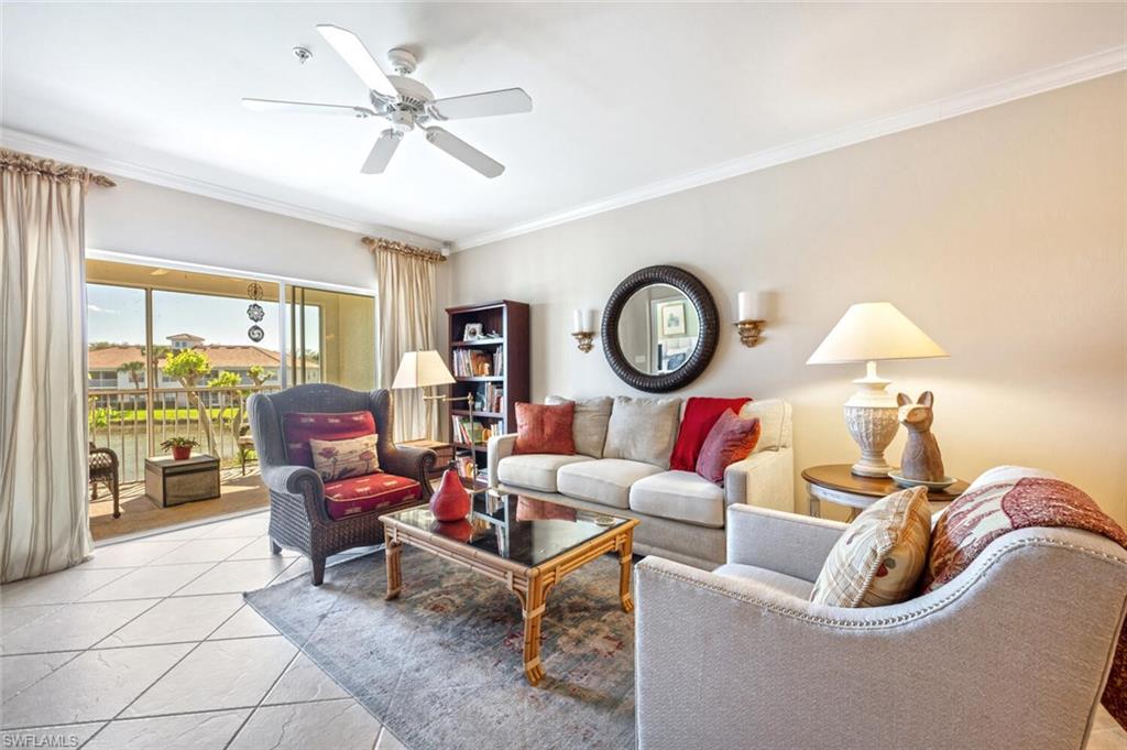 a living room with furniture a clock and a large window