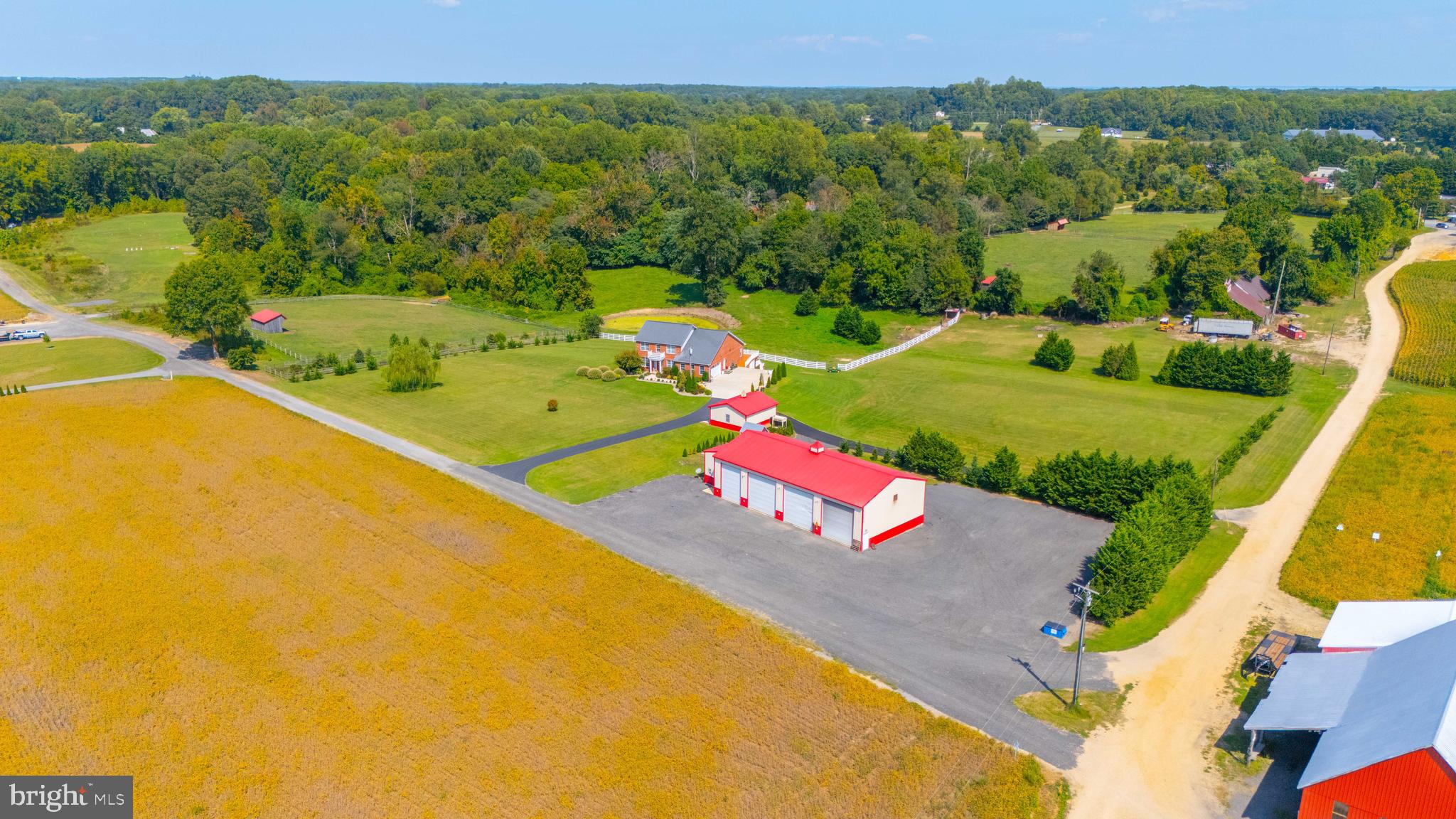 an aerial view of a house with a swimming pool