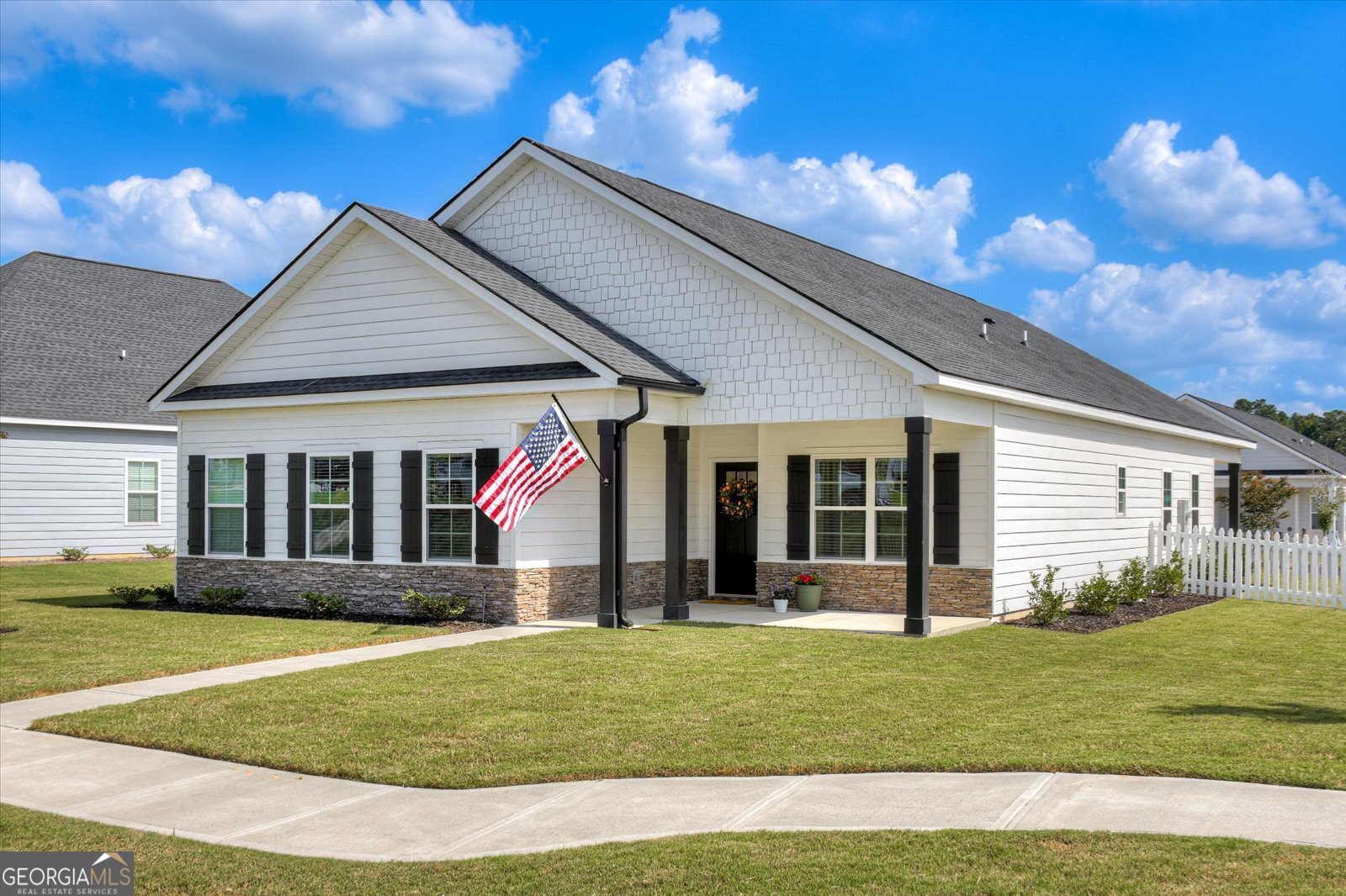 a front view of a house with a yard