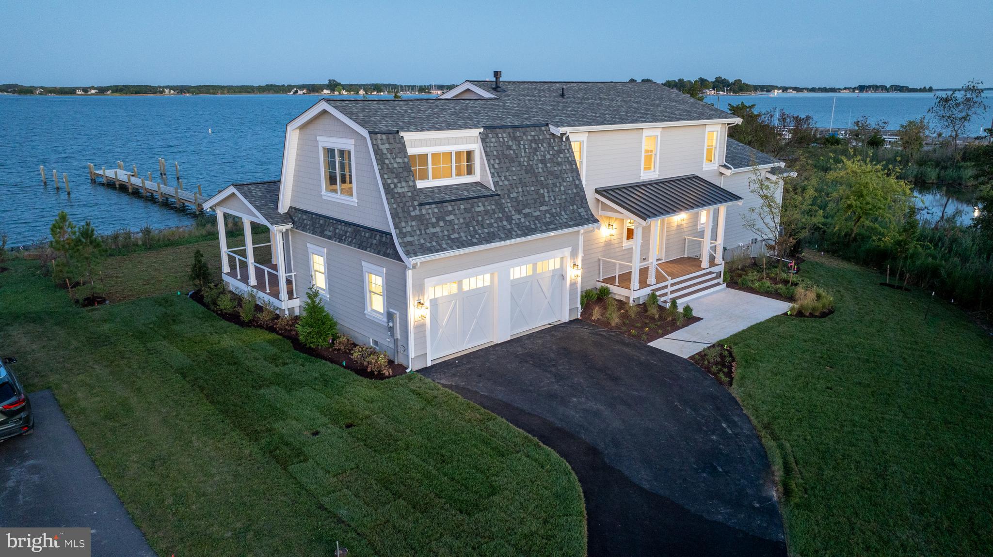 an aerial view of a house with a big yard