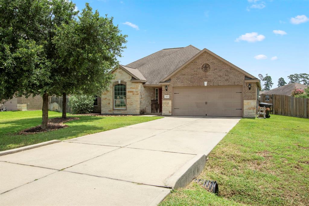 A long double driveway offers ample parking for residents and guests.