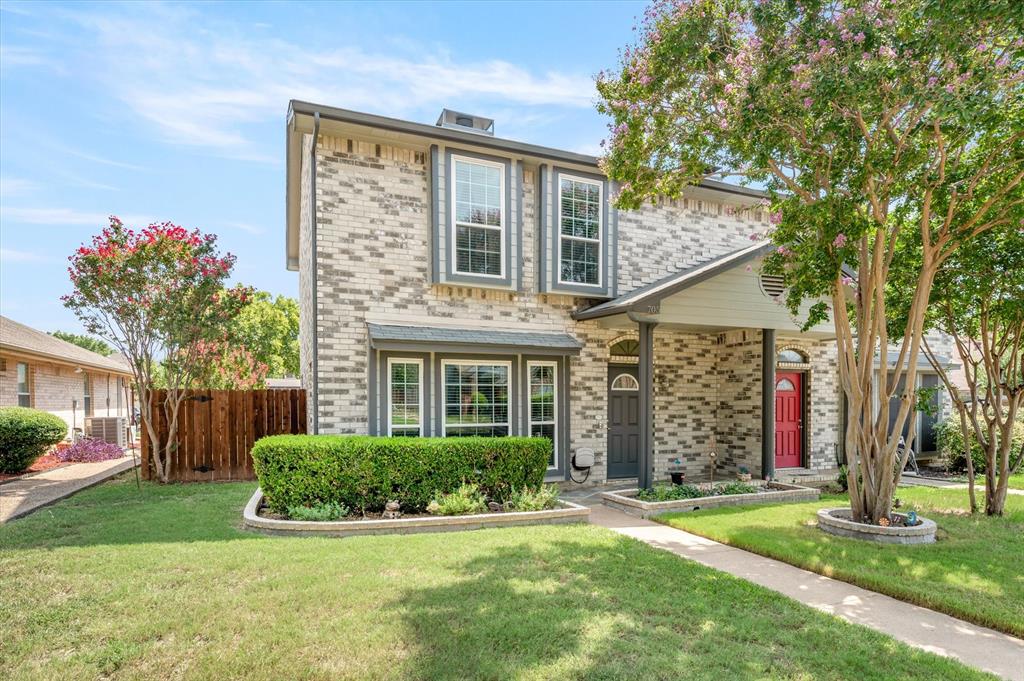 front view of a house with a yard