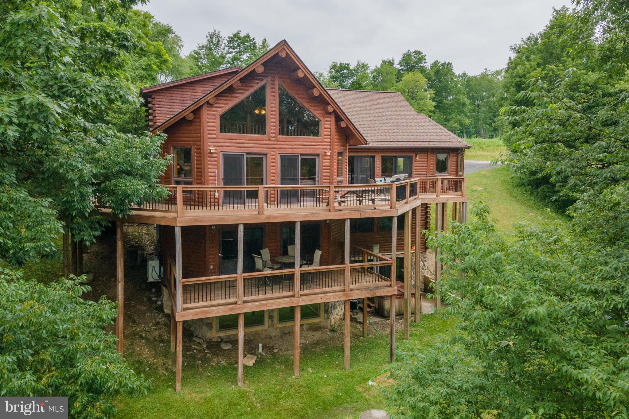 a front view of a house with a yard and balcony