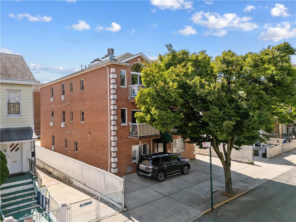 a view of a building with a tree