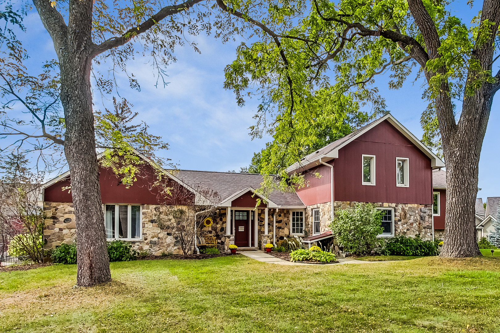 a front view of a house with a yard