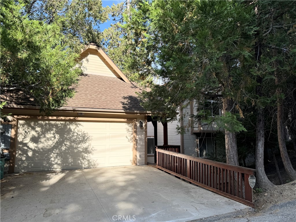 a view of house with tree in the background