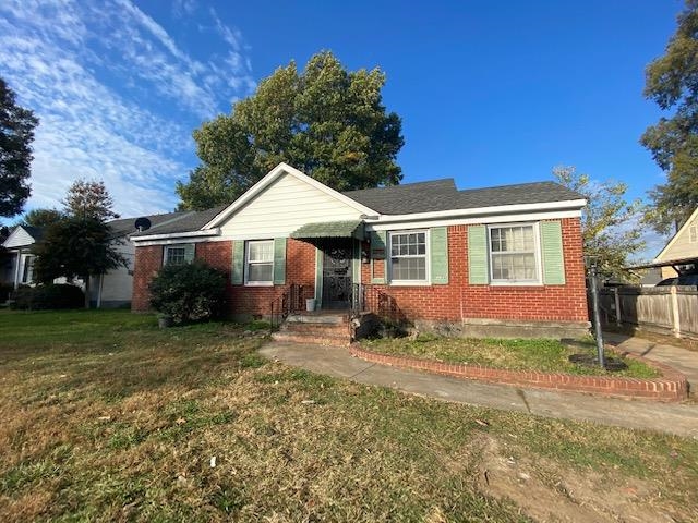 View of front of property with a front lawn