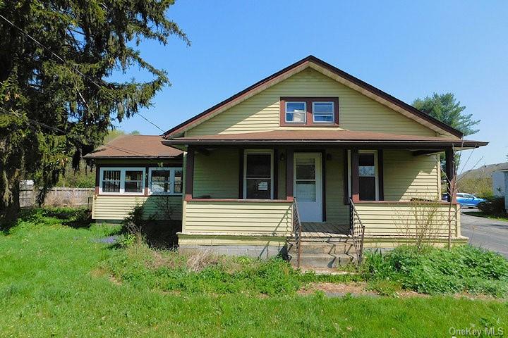 Bungalow featuring covered porch