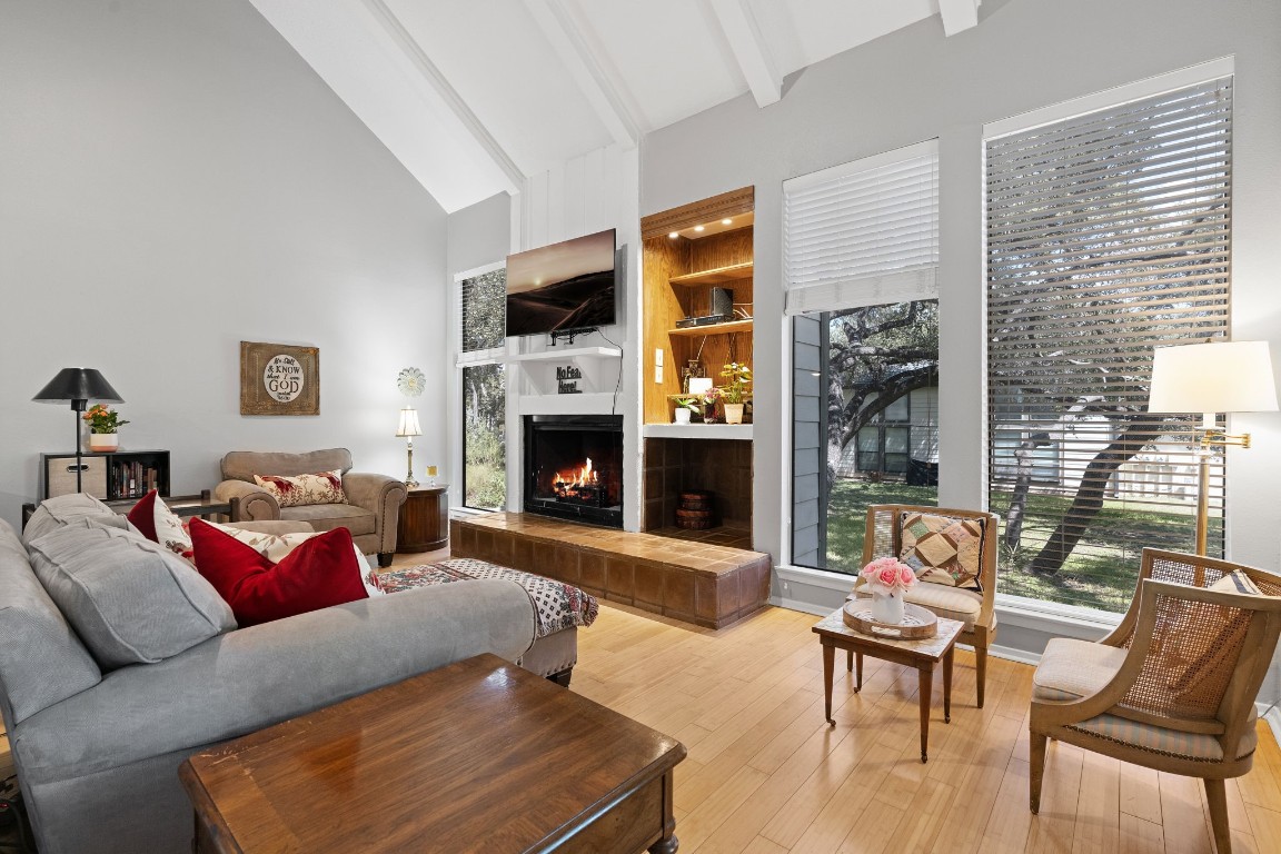 a living room with furniture and a fireplace