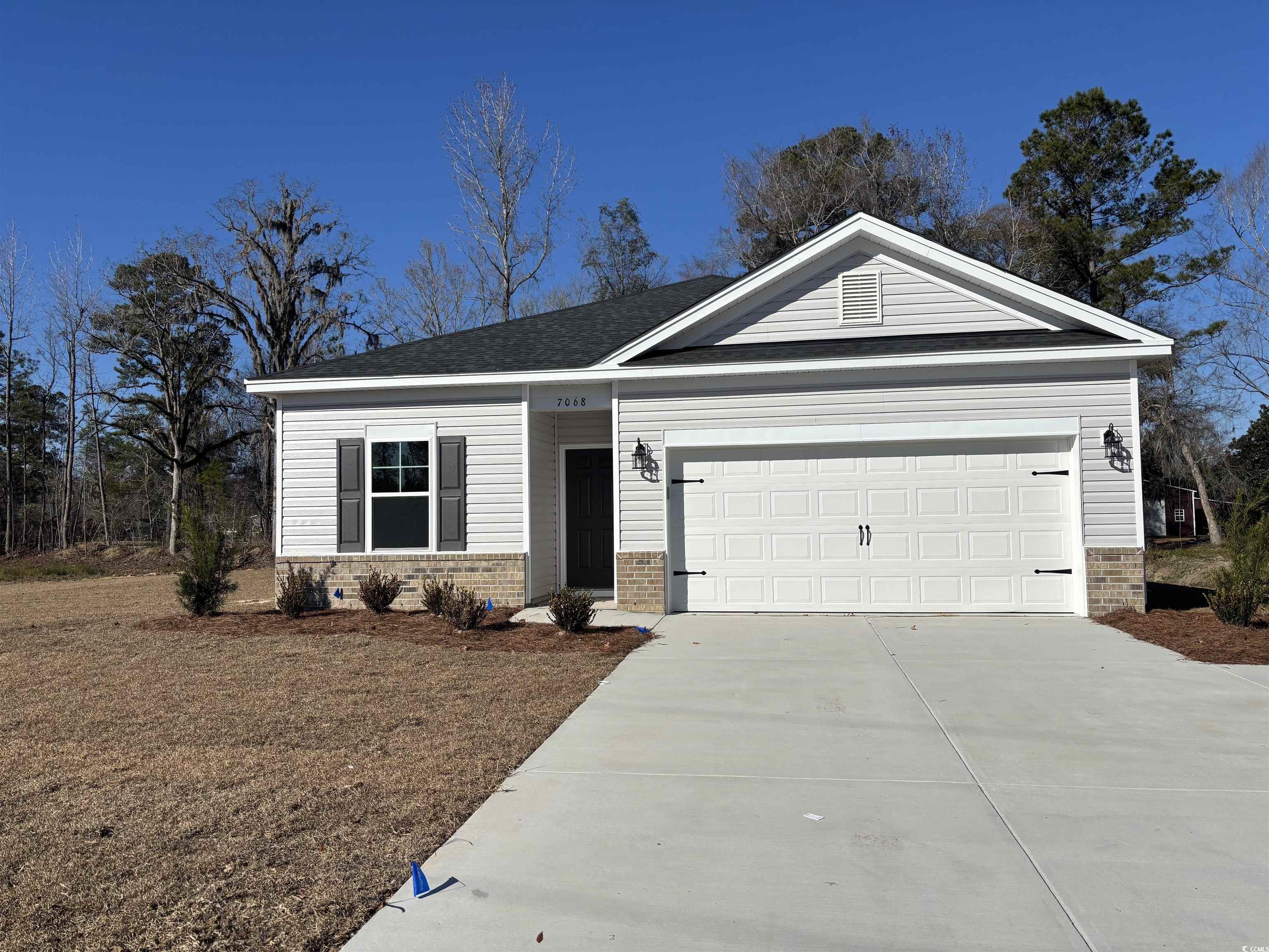 View of front of property with a garage