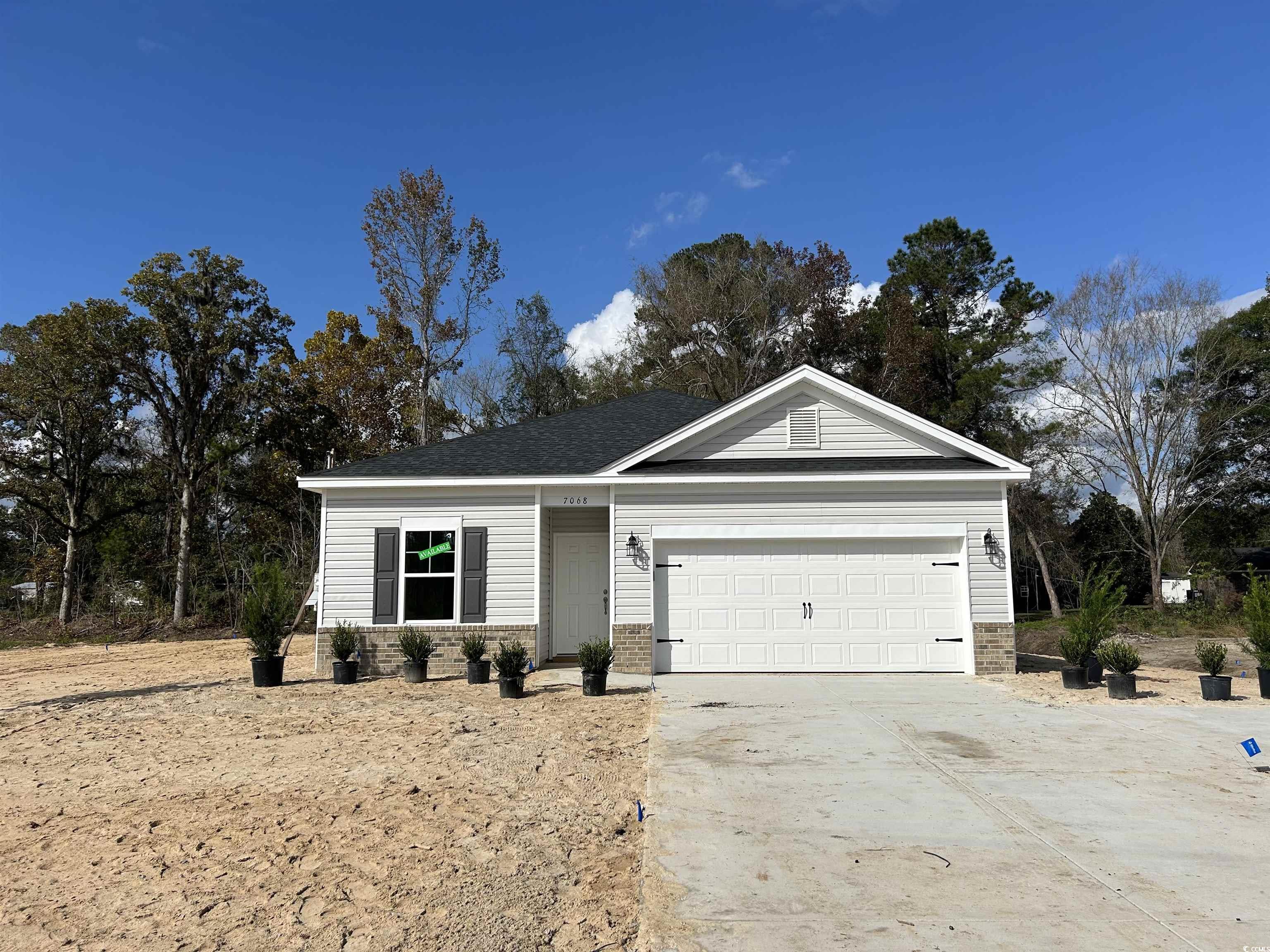 View of front of property with a garage