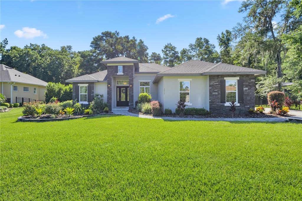 a front view of a house with garden