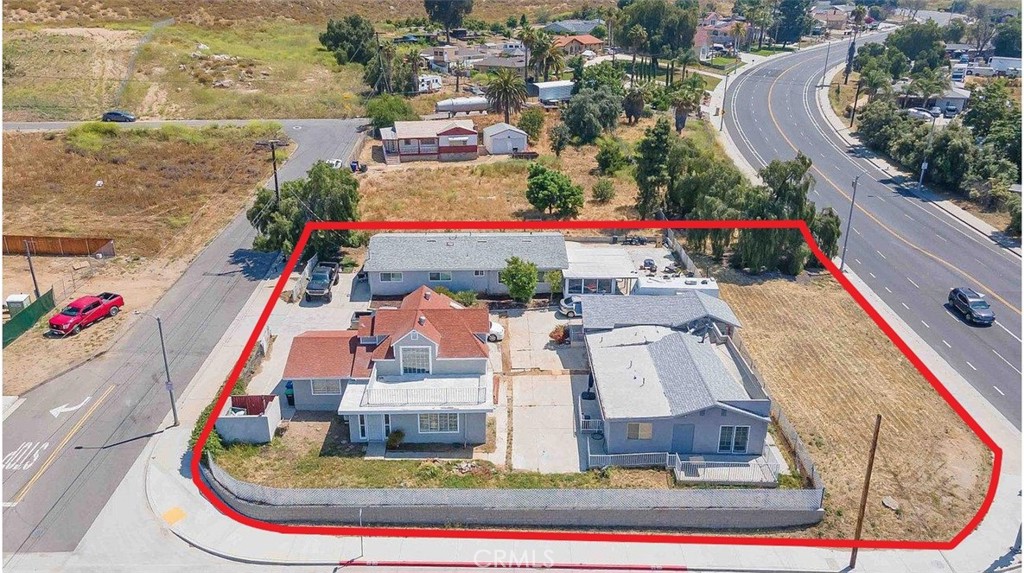 an aerial view of a house with outdoor space