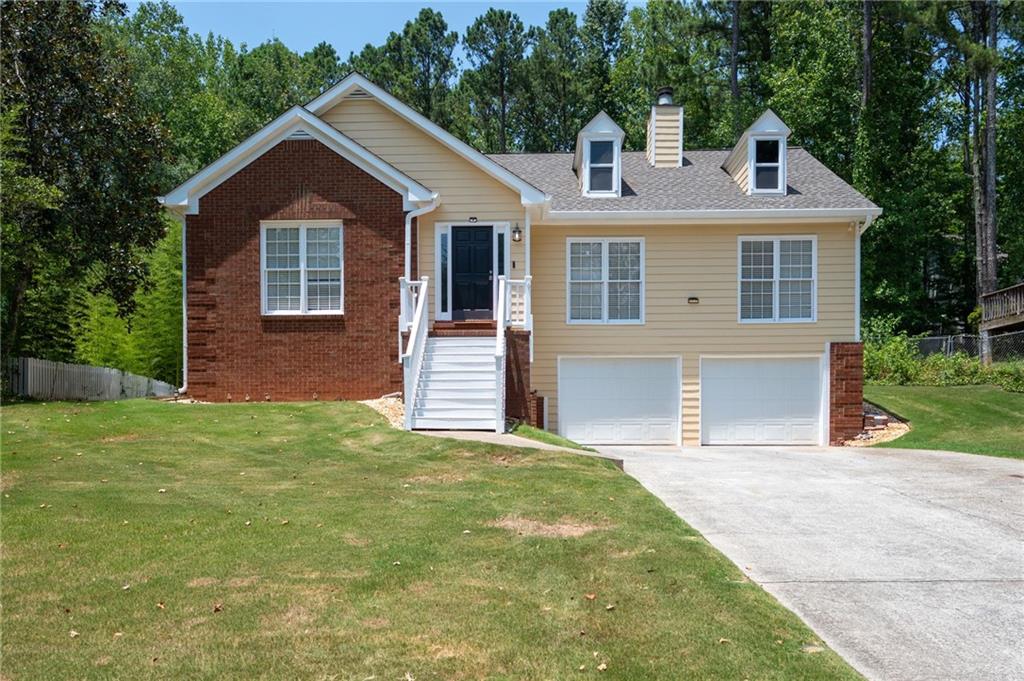 a front view of a house with a yard