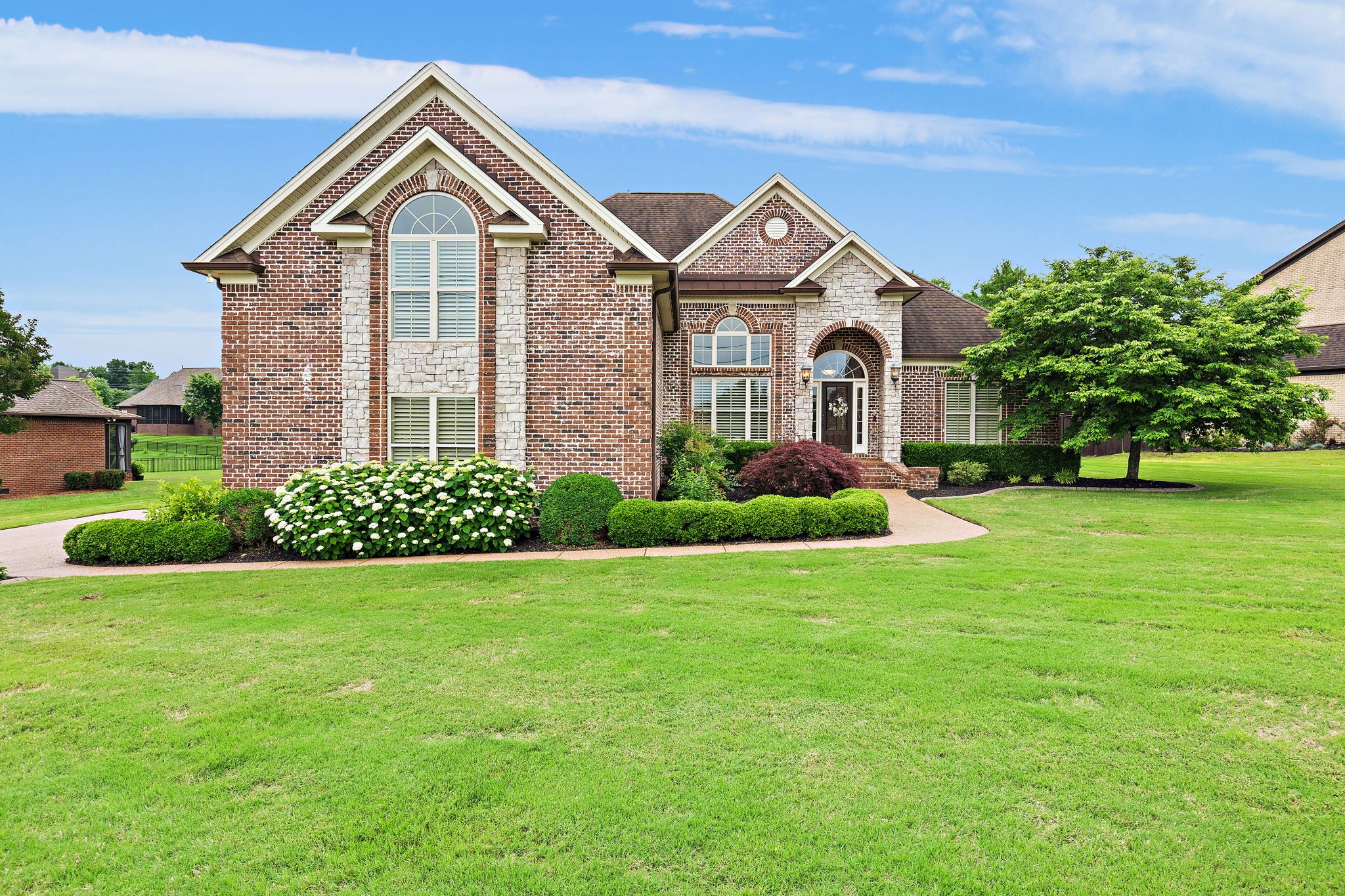 a front view of a house with a yard