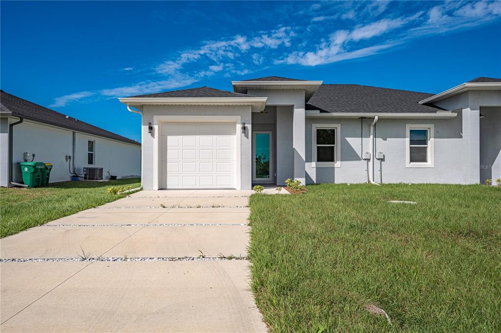 a view of a house with a yard