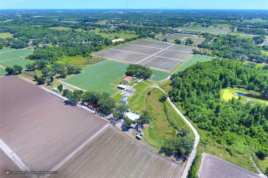 an aerial view of a house with a garden