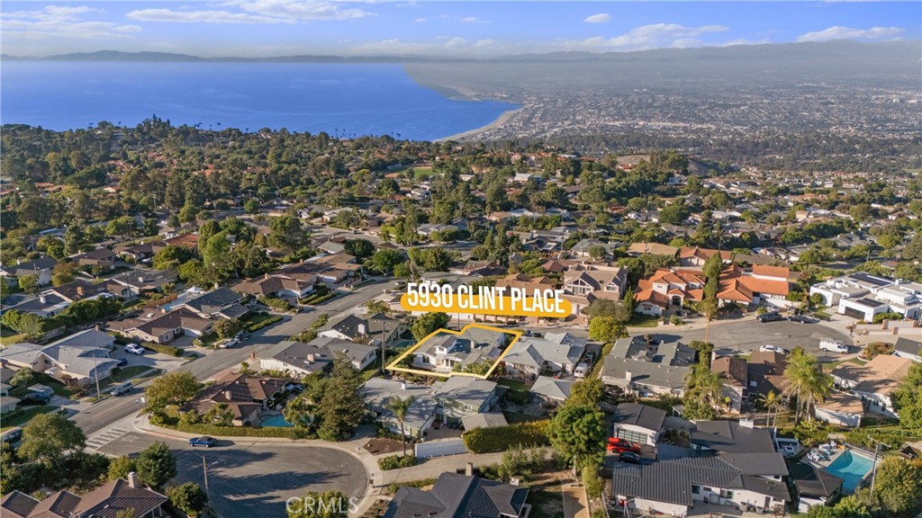 an aerial view of residential building with green space