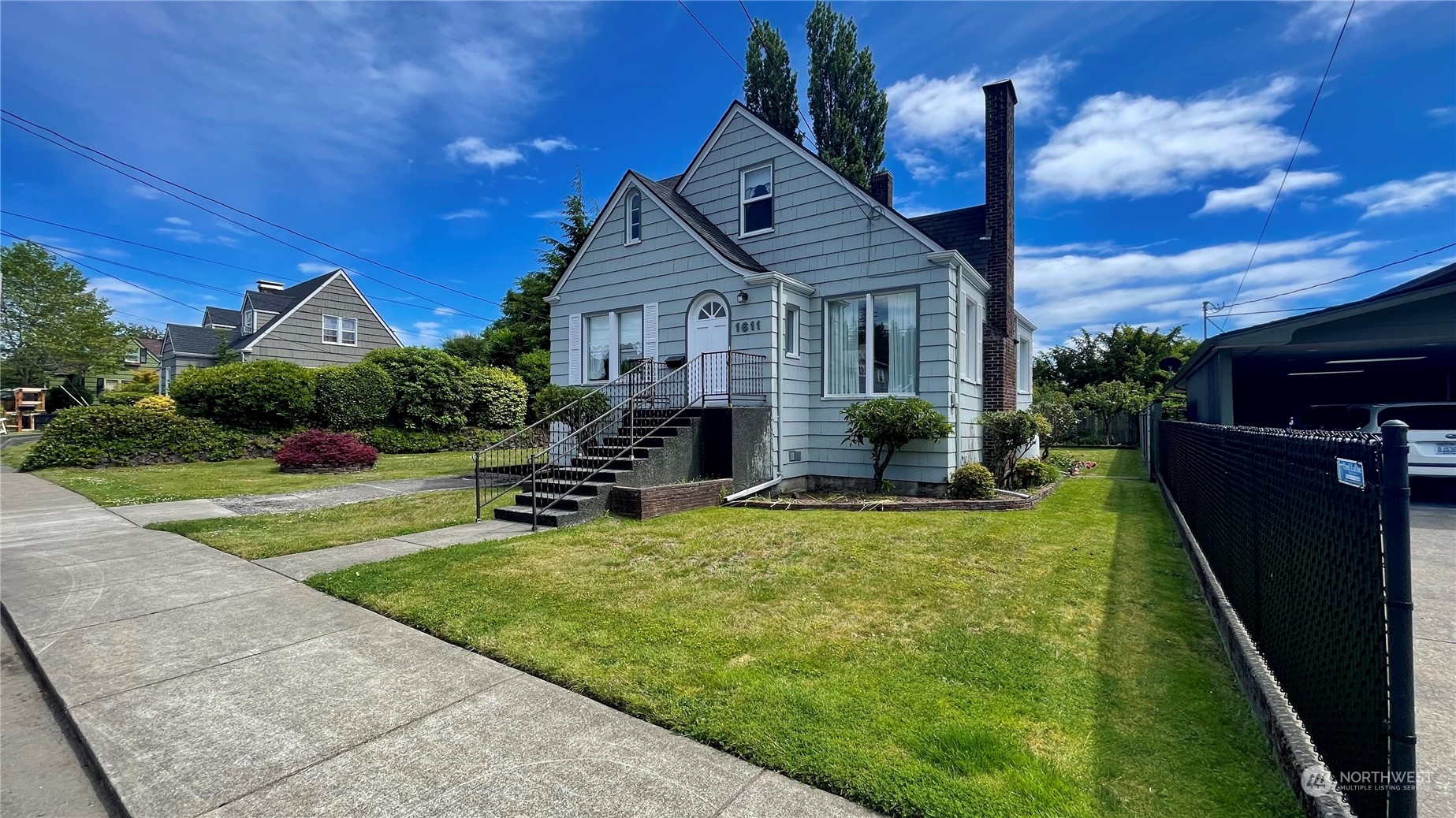 a view of a house with backyard sitting area and garden