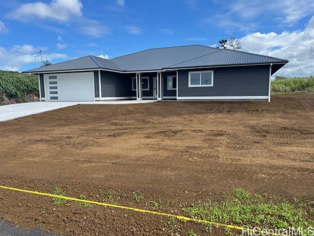 a front view of a house with yard