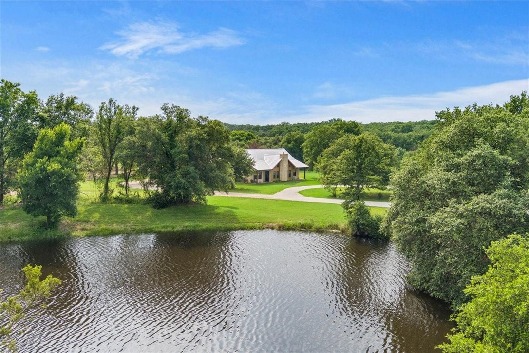 a view of a lake with a yard