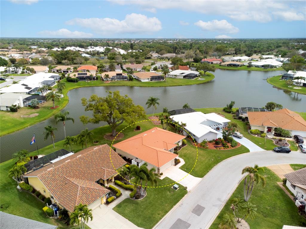 an aerial view of a house with a lake view