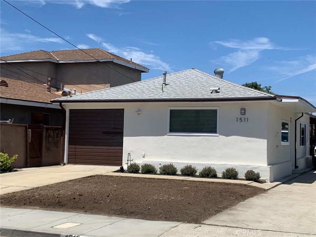 a front view of a house with a garage