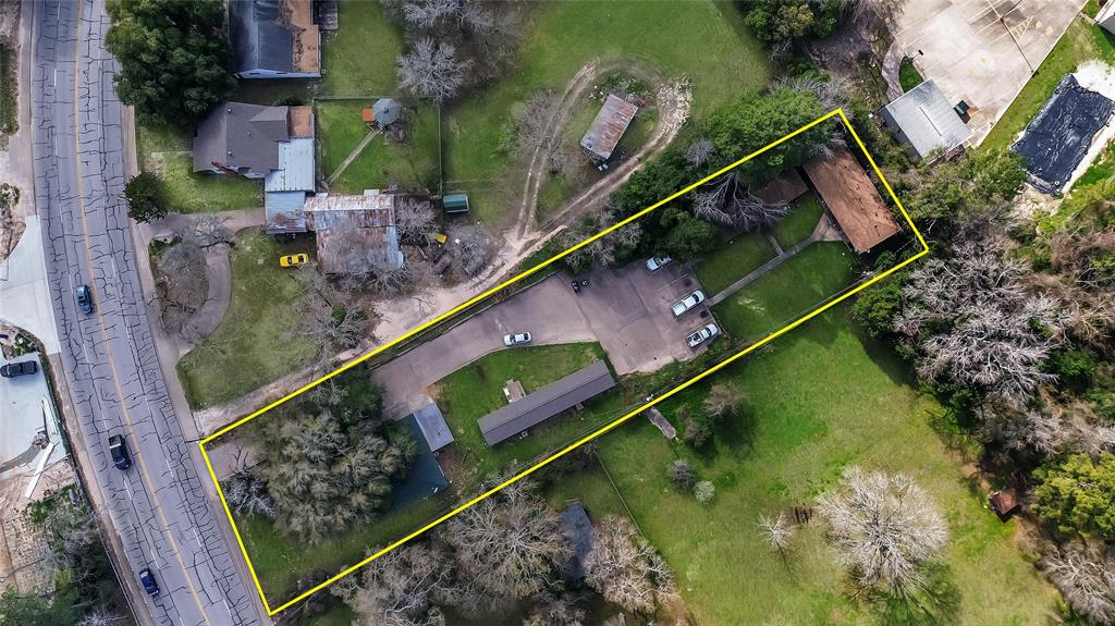 an aerial view of house with a yard