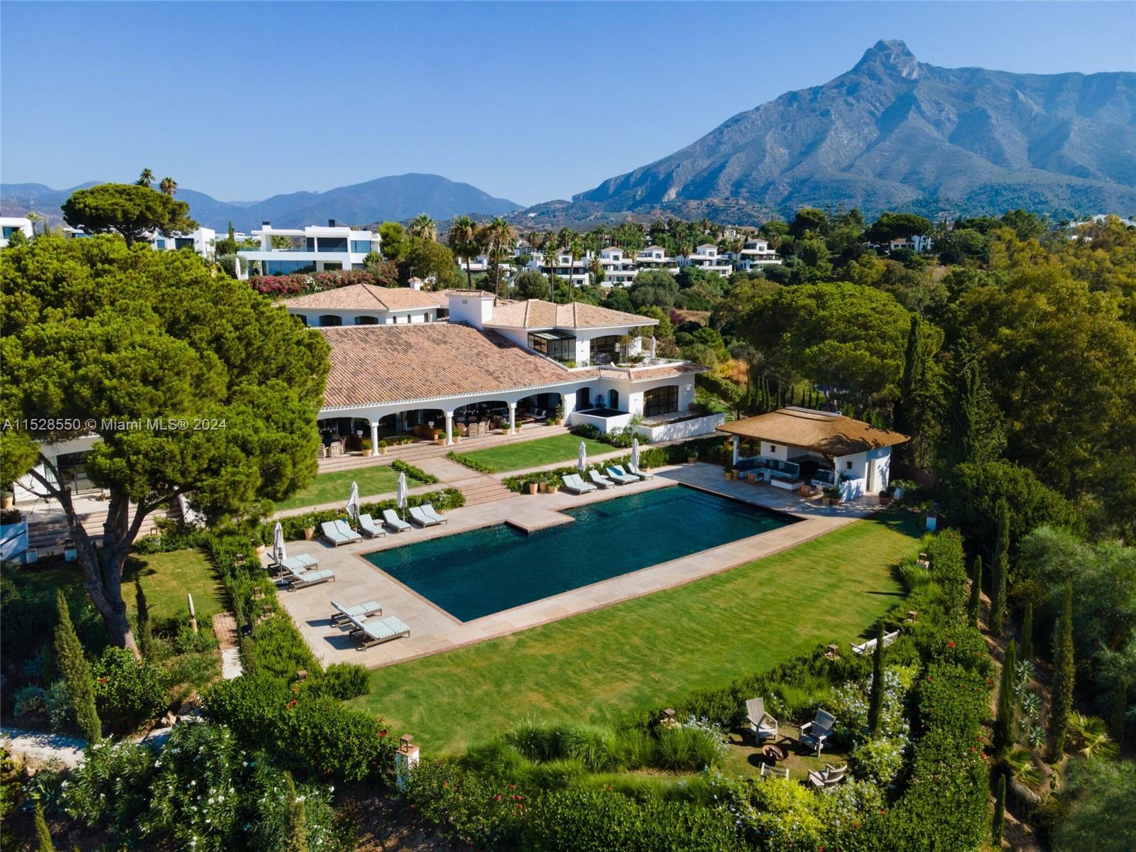 an aerial view of multiple houses with a yard