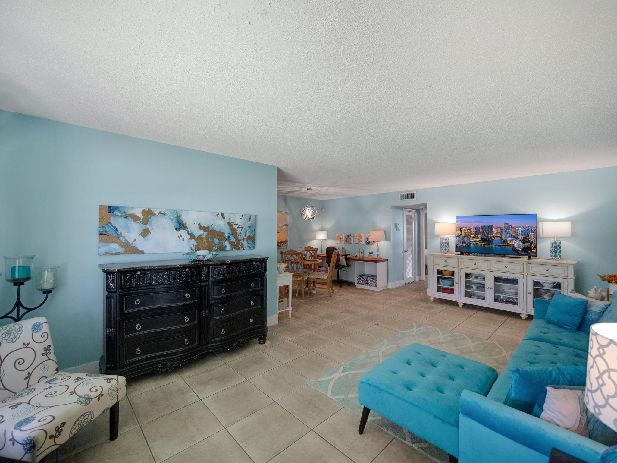 a living room with furniture and a flat screen tv