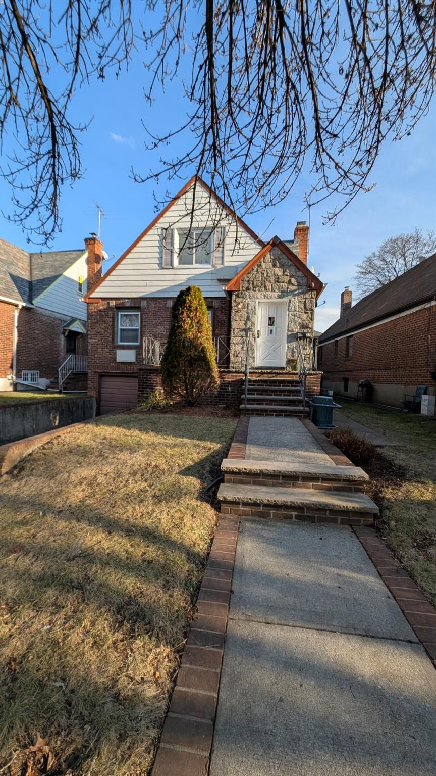 View of front of house with a front lawn