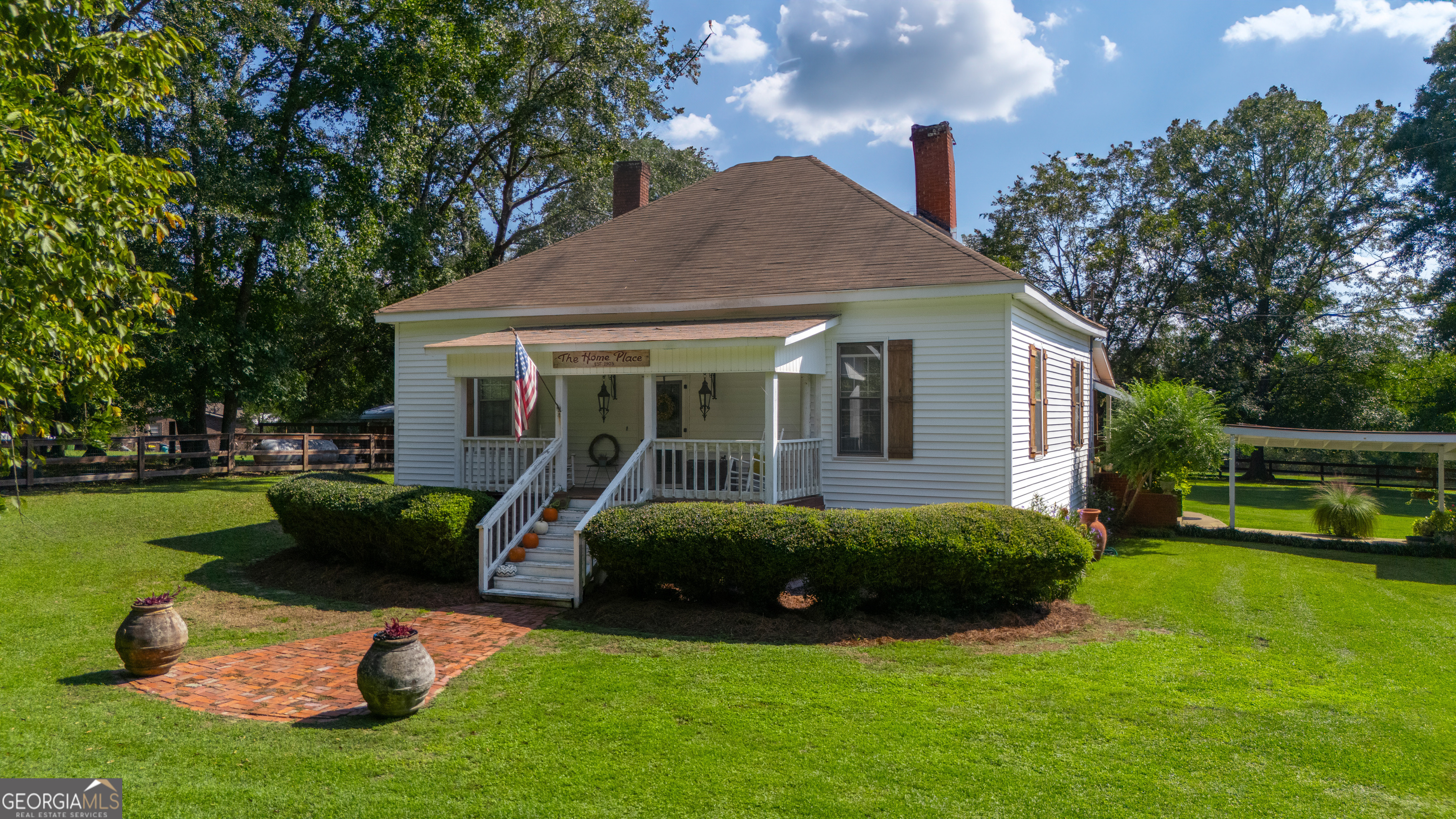 a view of a house with a yard porch and sitting area