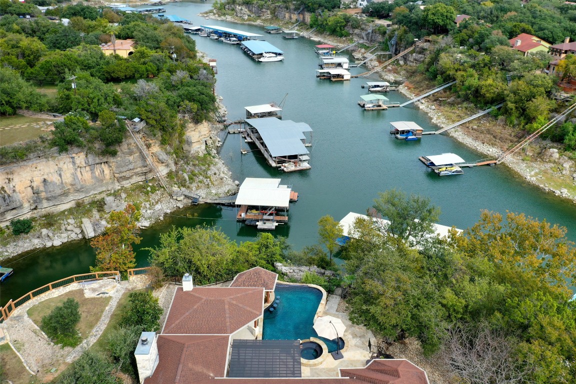 an aerial view of a house with swimming pool and outdoor space