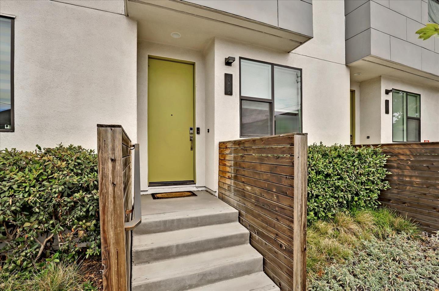 a view of front door of house with stairs