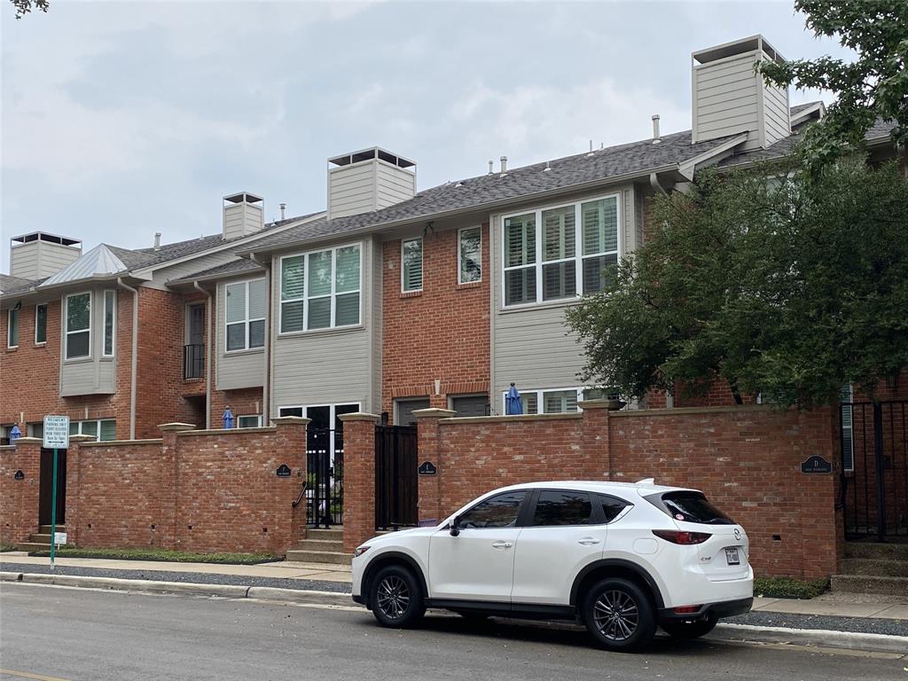 a view of a car parked in front of a building