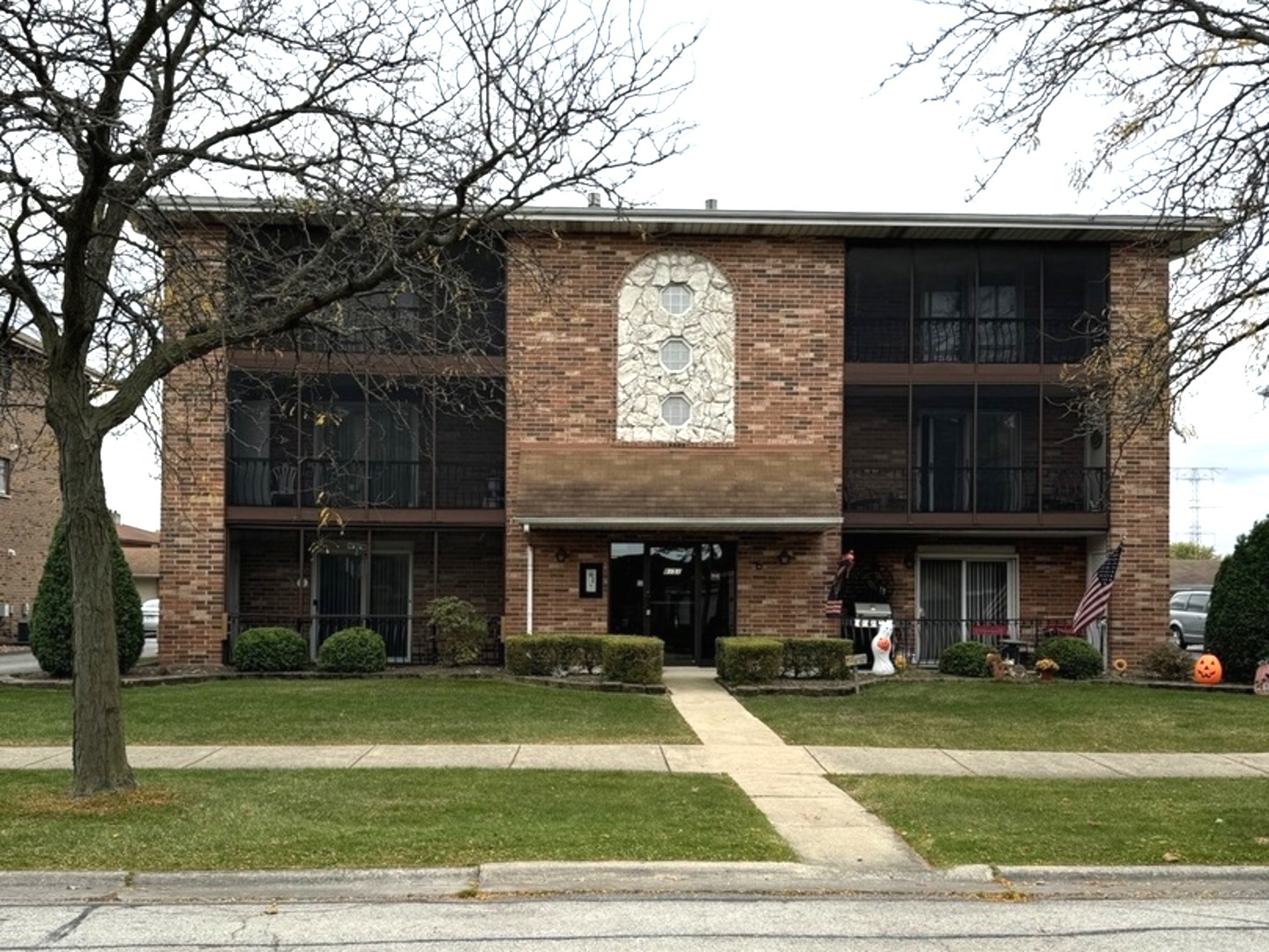 a view of a brick building with a yard