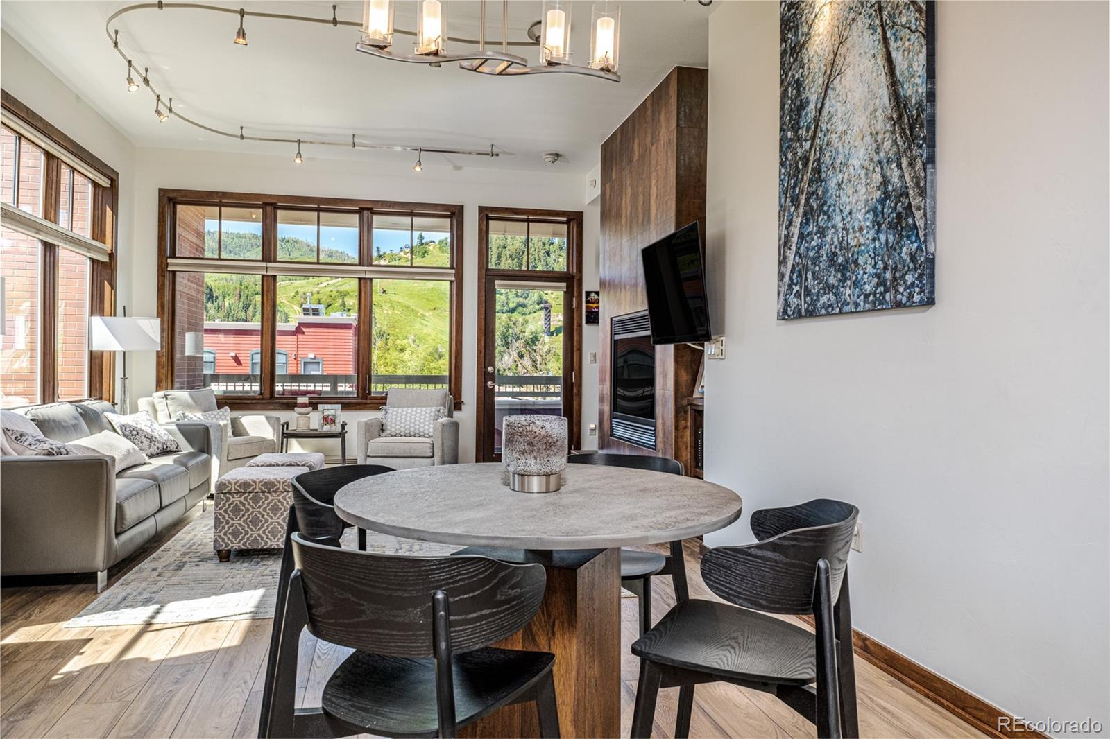 a view of a dining room with furniture window and outside view