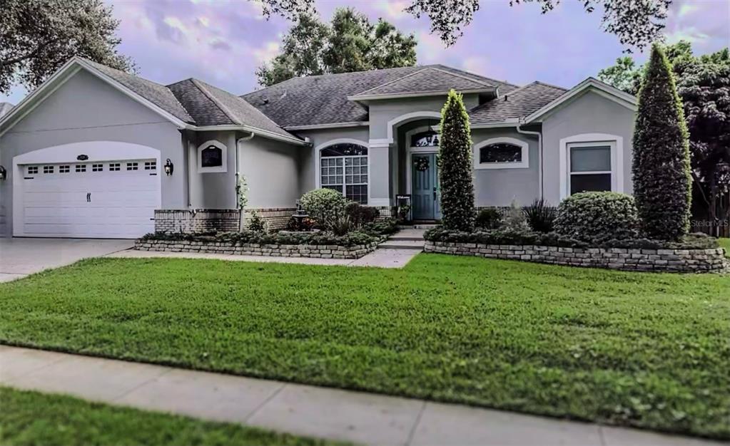 a front view of a house with garden